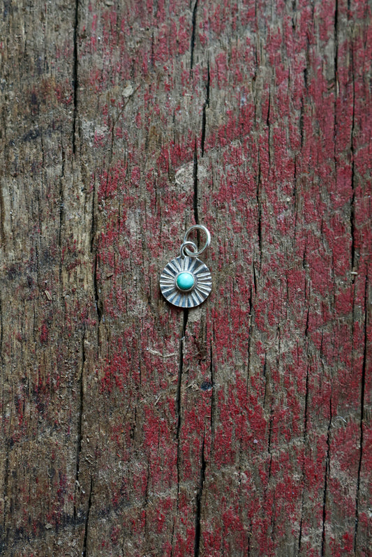 Sun Ray Stamped Turquoise Charm